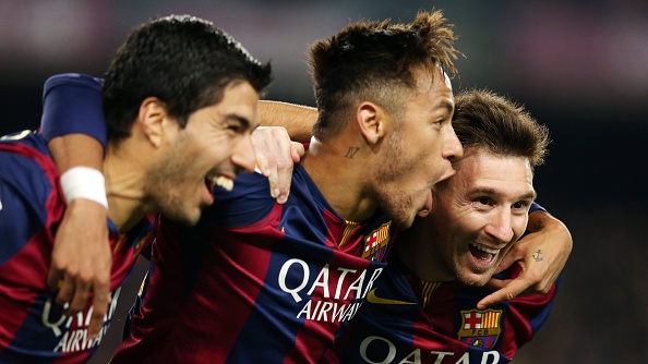 BARCELONA, SPAIN - JANUARY 11: Lionel Messi of FC Barcelona celebrates scoring his team's third goal with team-mates Neymar and Luis Suarez during the La Liga match between FC Barcelona and Atletico Madrid at Camp Nou on January 11, 2015 in Barcelona, Spain.  (Photo by Miguel Ruiz/FC Barcelona via Getty Images)