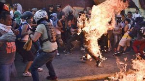 Fresh Venezuela clashes after man burned alive